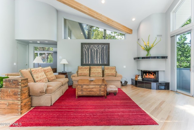 4916 Juniper Ln, Vail, CO 81657 - living area with wood finished floors, a tile fireplace, healthy amount of natural light, recessed lighting, and high vaulted ceiling