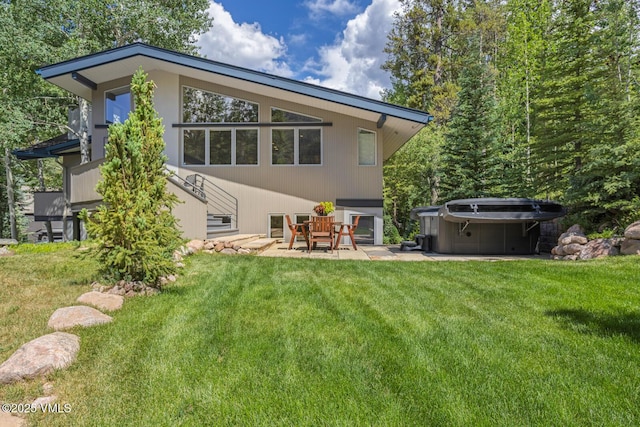 4916 Juniper Ln, Vail, CO 81657 - back of property with a yard, a patio, and a hot tub