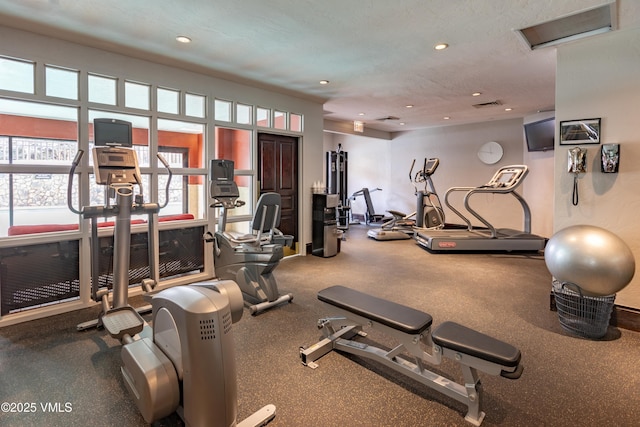 gym with a textured ceiling