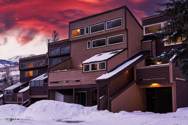 view of snow covered house