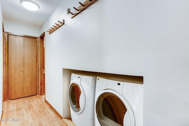 4595 Bighorn Rd Unit 5, Vail, CO 81657 - laundry room with separate washer and dryer and light wood-style floors