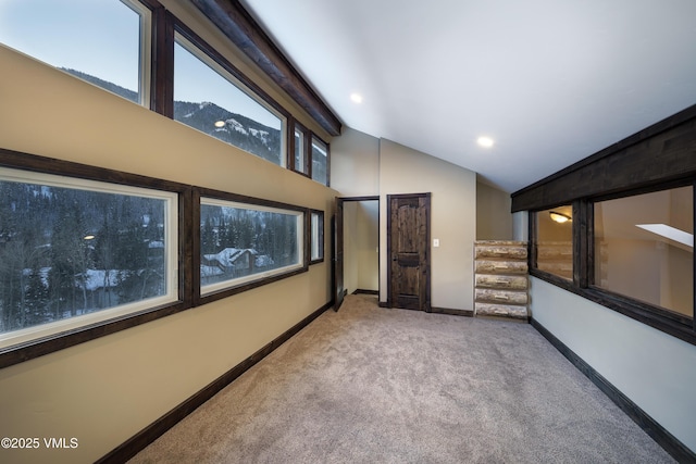 interior space featuring a mountain view and high vaulted ceiling