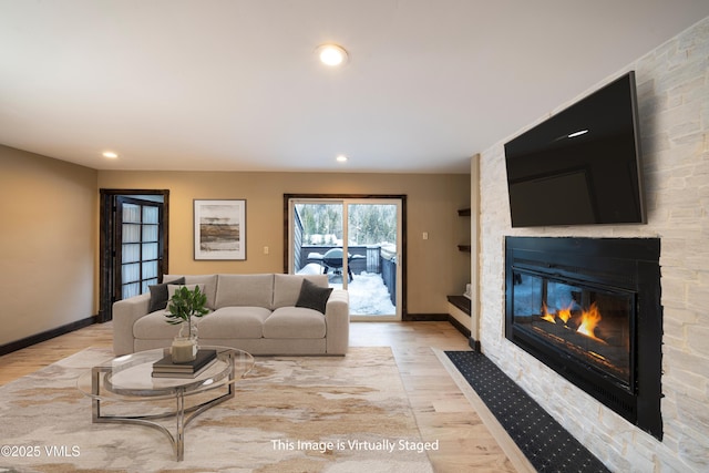 4595 Bighorn Rd Unit 5, Vail, CO 81657 - living room with light wood-style flooring, a fireplace, and recessed lighting