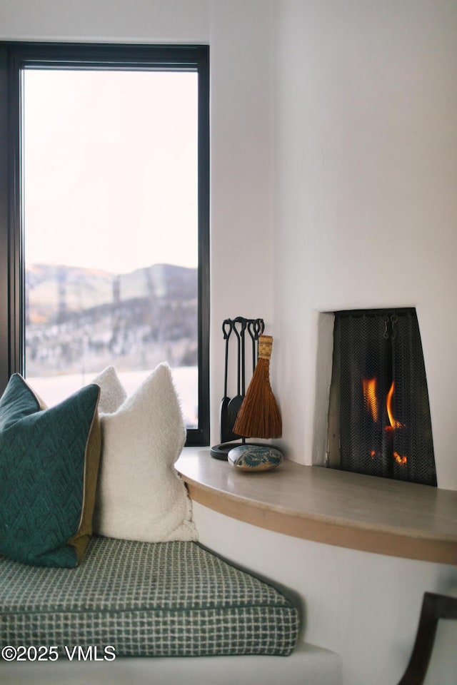 interior space featuring a lit fireplace