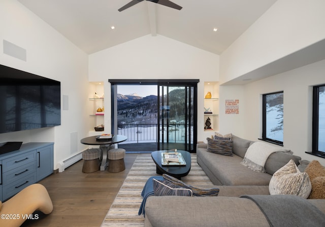 living room with beam ceiling, a baseboard heating unit, ceiling fan, wood finished floors, and high vaulted ceiling