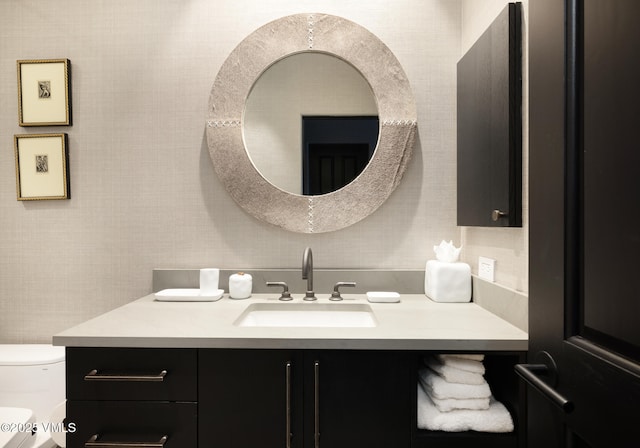 bathroom featuring vanity and toilet