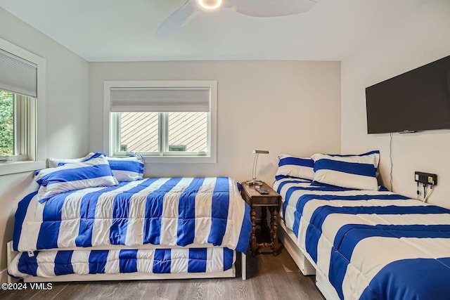 bedroom with wood-type flooring and ceiling fan