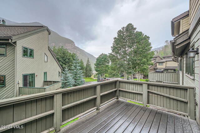 wooden deck featuring a mountain view