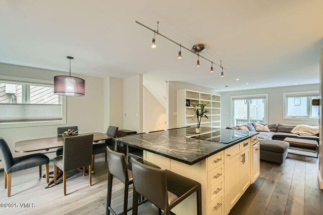 3930 Fall Line Dr Unit 12, Vail, CO 81657 - back of property featuring a yard, a garage, and asphalt driveway