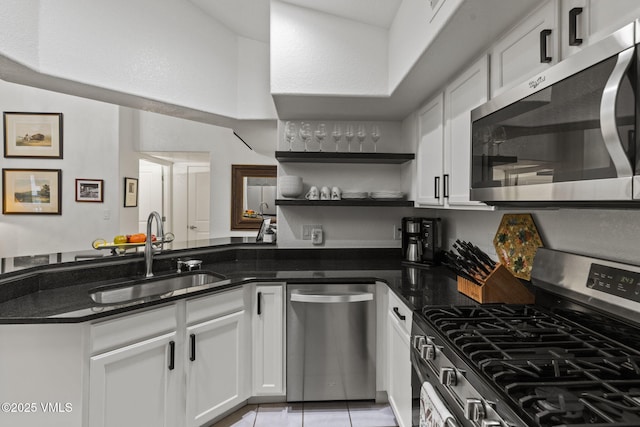 55 River Pines Ct Unit A302, Edwards, CO 81632 - kitchen featuring appliances with stainless steel finishes, a sink, white cabinets, and open shelves