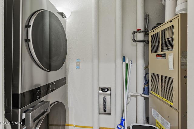 55 River Pines Ct Unit A302, Edwards, CO 81632 - laundry room with stacked washer / dryer and heating unit