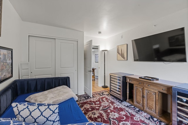55 River Pines Ct Unit A302, Edwards, CO 81632 - bedroom with beverage cooler, a closet, and wood finished floors
