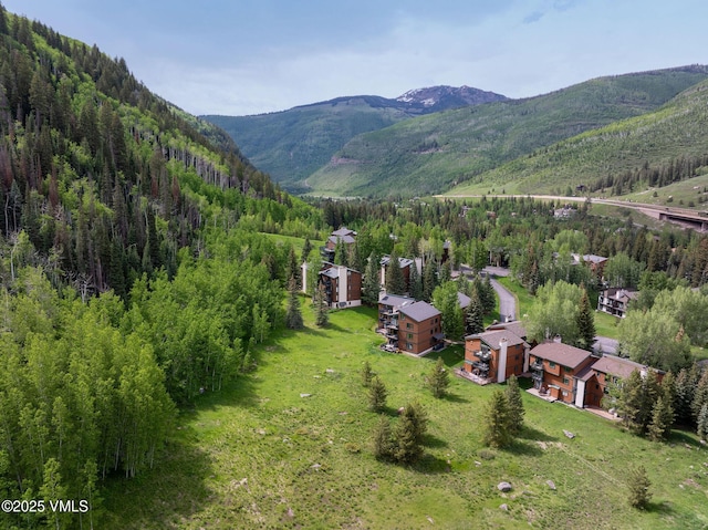 4470 Timber Falls Ct Unit 1407, Vail, CO 81657 - drone / aerial view of a mountain backdrop and a forest