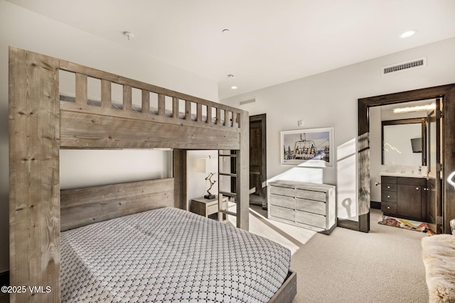 carpeted bedroom featuring recessed lighting and visible vents