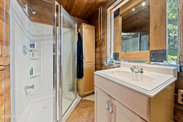 245 Main St, Eagle, CO 81631 - full bathroom featuring a stall shower, wooden ceiling, vanity, and tile patterned floors