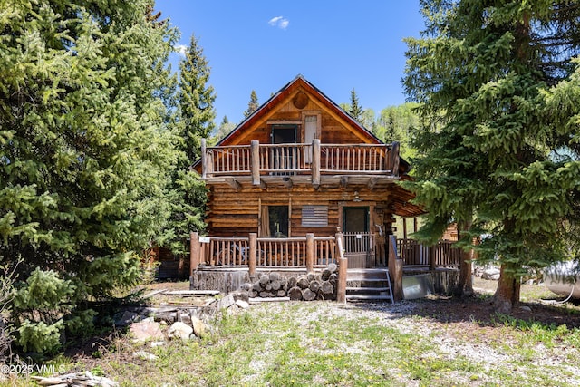 245 Main St, Eagle, CO 81631 - view of front of home with a balcony and log exterior