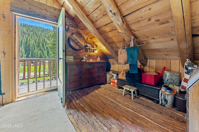 245 Main St, Eagle, CO 81631 - carpeted bedroom with wood ceiling, multiple windows, and wood walls