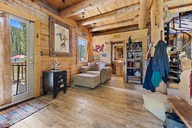 245 Main St, Eagle, CO 81631 - living area with a wood ceiling with exposed beams, hardwood / wood-style floors, healthy amount of natural light, and wood walls