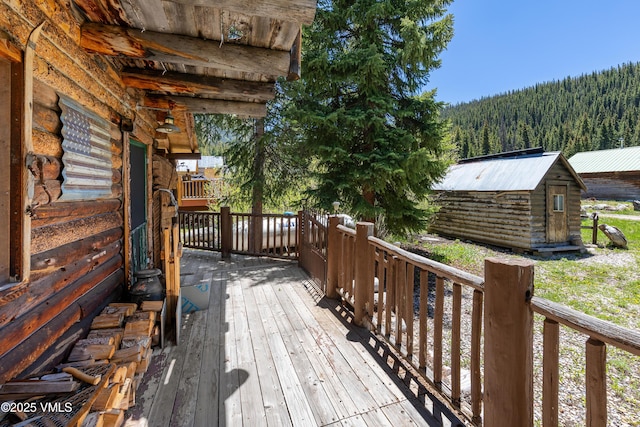 245 Main St, Eagle, CO 81631 - wooden deck with a view of trees and a shed