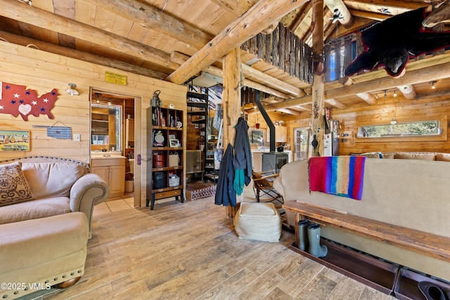 245 Main St, Eagle, CO 81631 - living area with wooden walls, light wood-type flooring, and a wooden ceiling with exposed beams