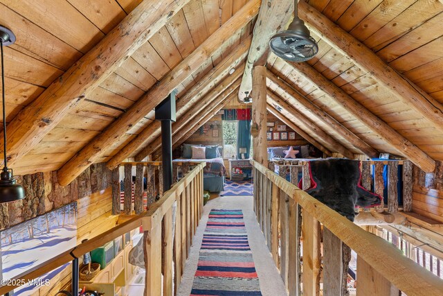 245 Main St, Eagle, CO 81631 - bedroom with wooden ceiling, carpet flooring, and wood walls