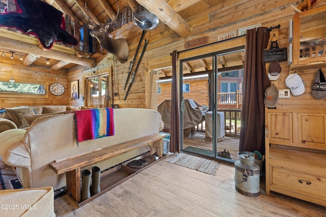 245 Main St, Eagle, CO 81631 - interior space with wooden walls, a wood ceiling with exposed beams, and hardwood / wood-style flooring