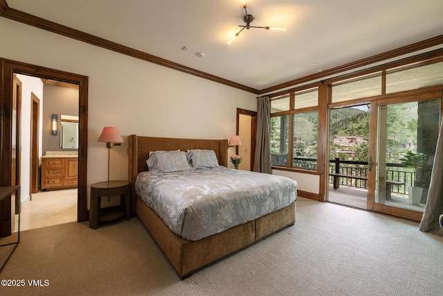 185 Forest Rd Unit A, Vail, CO 81657 - bedroom with ornamental molding, access to exterior, light carpet, and ensuite bathroom