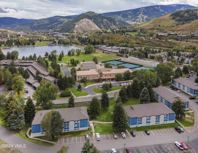 bird's eye view with a water and mountain view