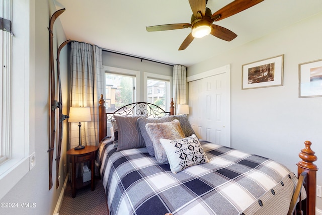 bedroom featuring carpet, ceiling fan, and a closet