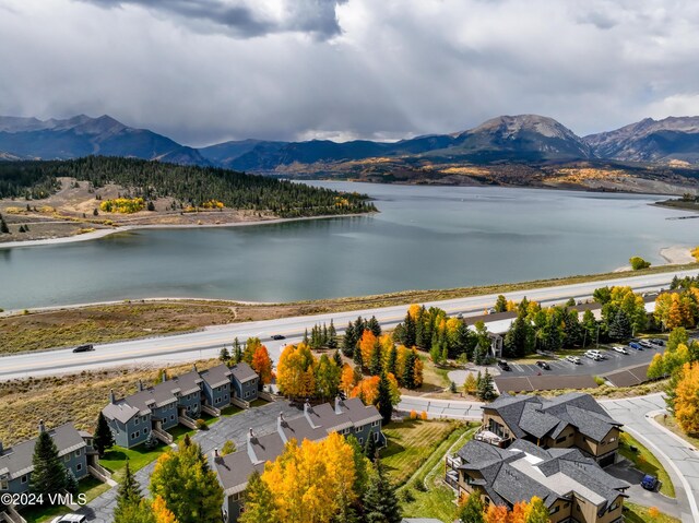 aerial view featuring a water and mountain view