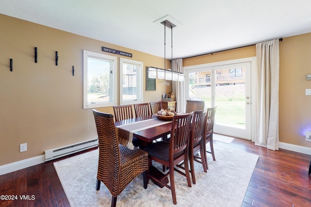 dining space featuring dark wood-type flooring and a baseboard radiator