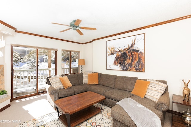 carpeted living room featuring crown molding and ceiling fan