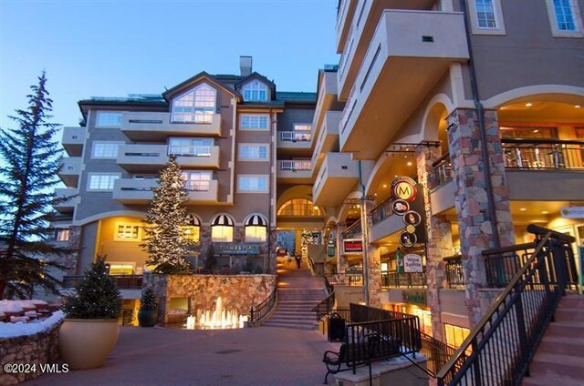 view of outdoor building at dusk