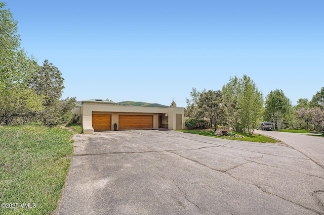 482 Charolais Cir, Edwards, CO 81632 - view of front of house featuring stucco siding, concrete driveway, and a garage