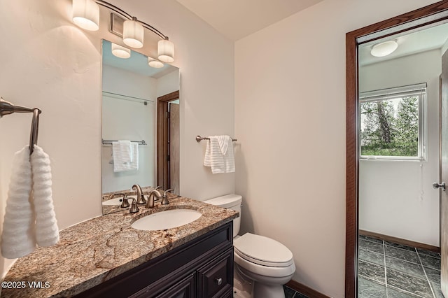482 Charolais Cir, Edwards, CO 81632 - bathroom with toilet, vanity, and baseboards