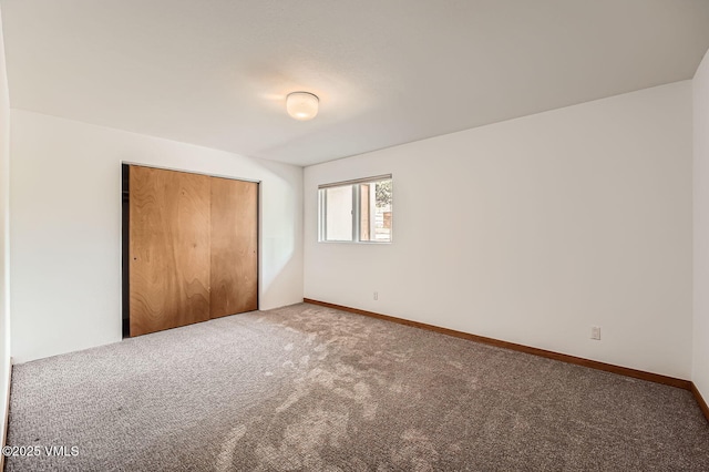 482 Charolais Cir, Edwards, CO 81632 - unfurnished bedroom featuring carpet, a closet, and baseboards