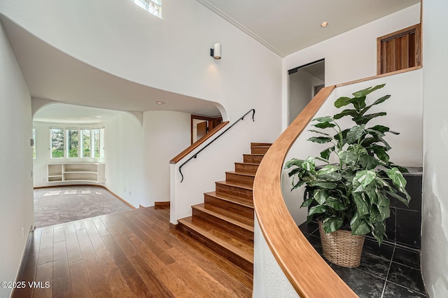 482 Charolais Cir, Edwards, CO 81632 - stairway with arched walkways, hardwood / wood-style floors, and recessed lighting