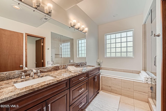482 Charolais Cir, Edwards, CO 81632 - bathroom featuring double vanity, a garden tub, tile patterned floors, and an enclosed shower