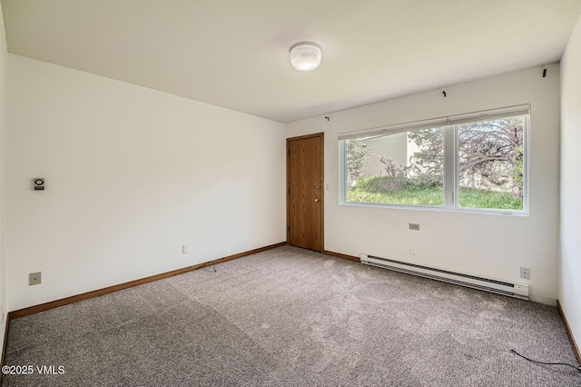 482 Charolais Cir, Edwards, CO 81632 - carpeted empty room featuring a baseboard radiator and baseboards