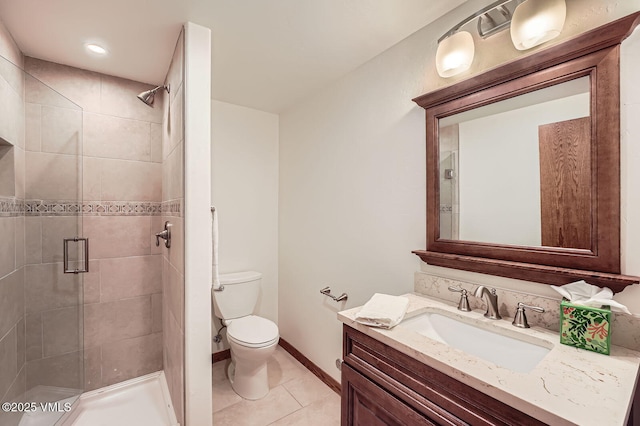 482 Charolais Cir, Edwards, CO 81632 - full bathroom featuring vanity, a shower stall, toilet, tile patterned flooring, and baseboards