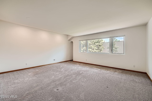 482 Charolais Cir, Edwards, CO 81632 - carpeted spare room featuring baseboards and arched walkways