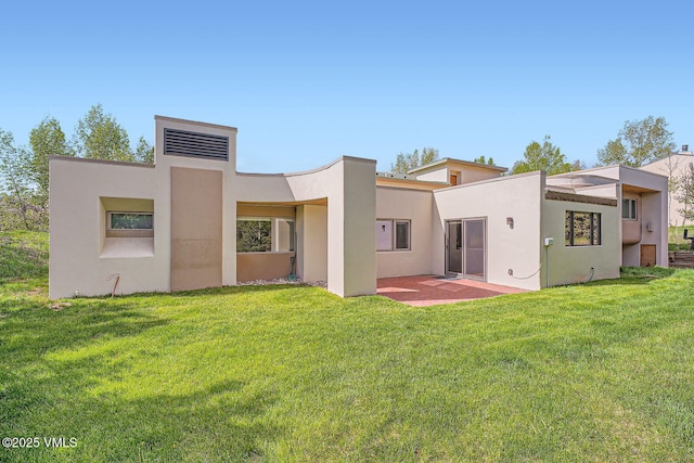 482 Charolais Cir, Edwards, CO 81632 - back of house featuring stucco siding and a lawn