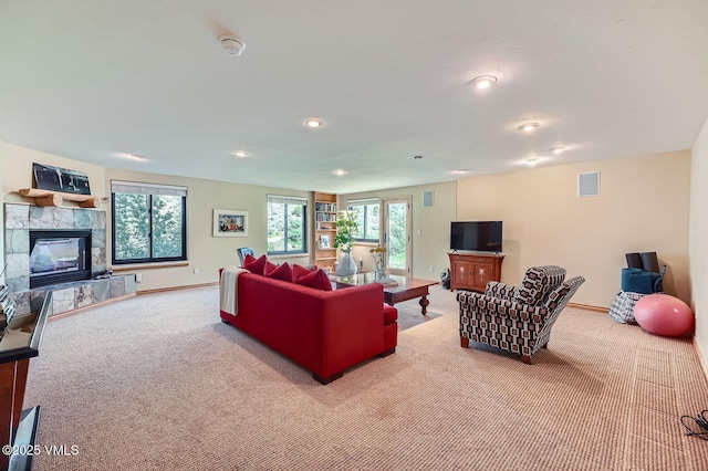 1140 June Creek Rd, Edwards, CO 81632 - carpeted living area with a fireplace, plenty of natural light, and recessed lighting