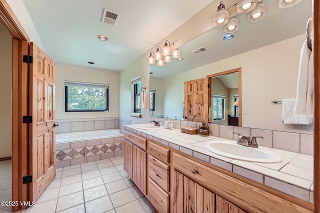 1140 June Creek Rd, Edwards, CO 81632 - bathroom featuring double vanity, a bath, and tile patterned floors