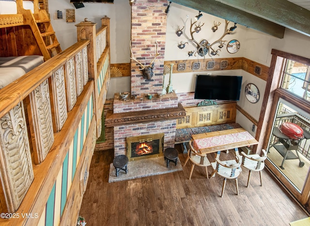 225 Wall St Unit 303, Vail, CO 81657 - living room featuring wood finished floors and a brick fireplace