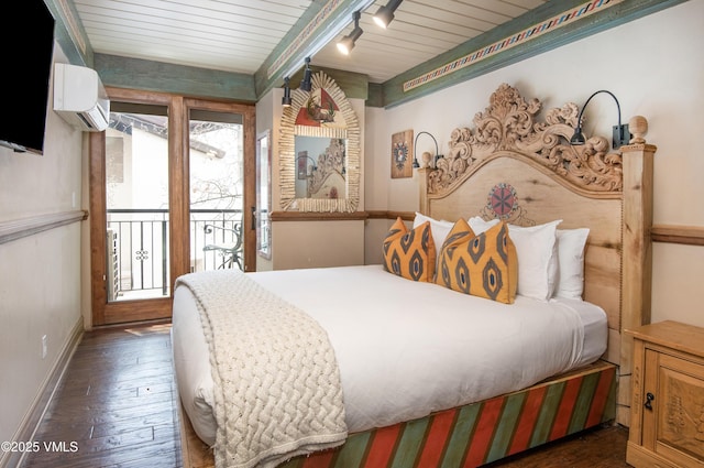 225 Wall St Unit 303, Vail, CO 81657 - bedroom with a wall unit AC, access to outside, wood finished floors, and a wooden ceiling with exposed beams