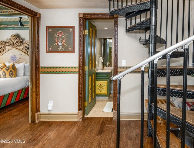 225 Wall St Unit 303, Vail, CO 81657 - stairs featuring wood finished floors and baseboards