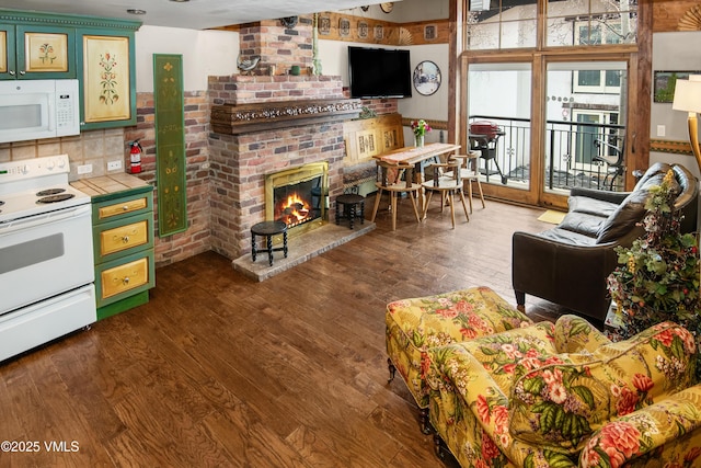 225 Wall St Unit 303, Vail, CO 81657 - living area with dark wood-style floors and a brick fireplace