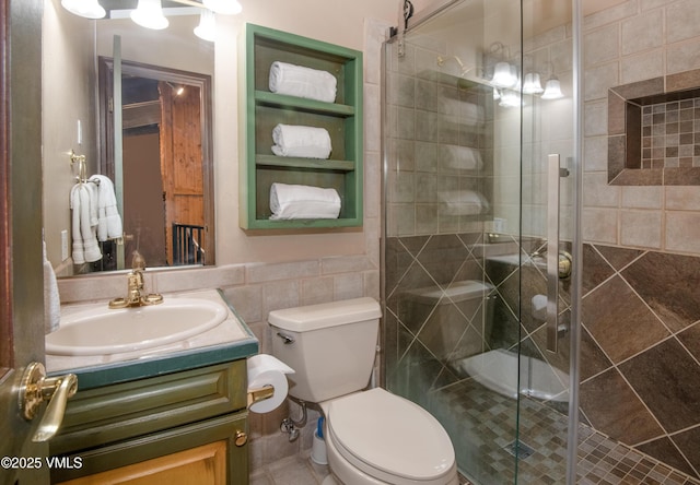 225 Wall St Unit 303, Vail, CO 81657 - full bathroom featuring vanity, tile walls, and a stall shower