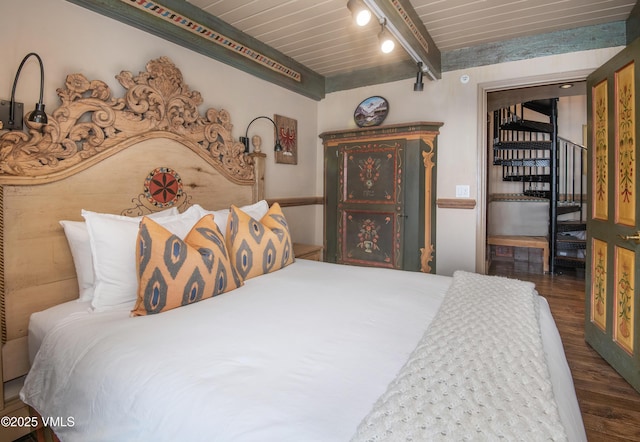 225 Wall St Unit 303, Vail, CO 81657 - bedroom with dark wood-style floors and a wood ceiling with exposed beams